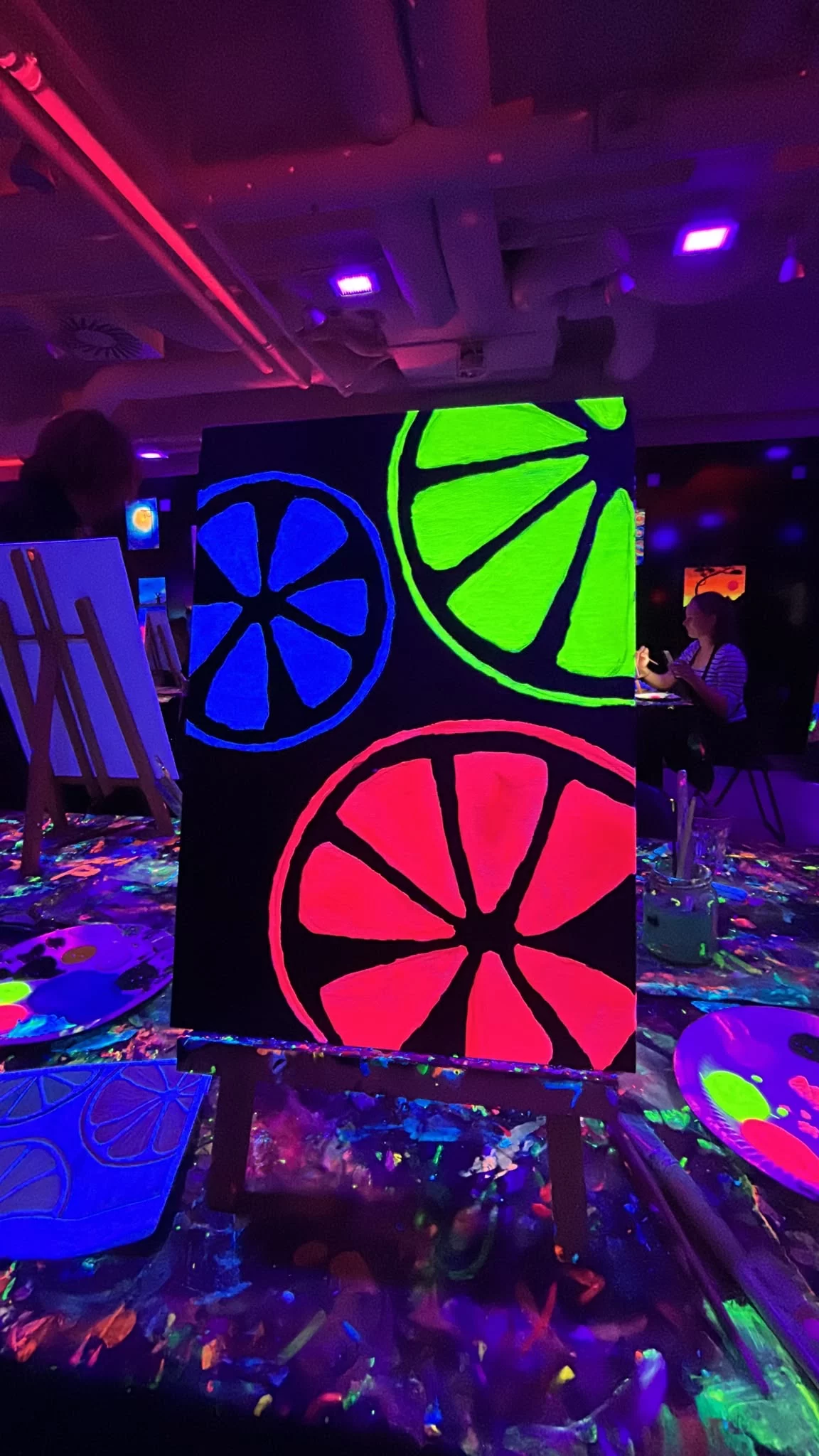 Fluorescent painting with blue, green and pink citrus fruit at Rembrandt van Wine
